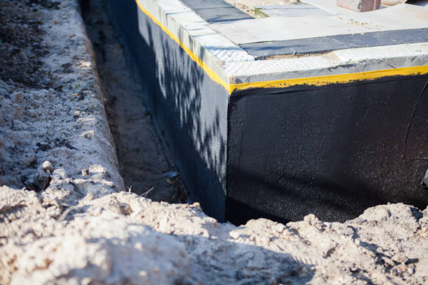 Professional Basement Waterproofing technician working in Midland, MI